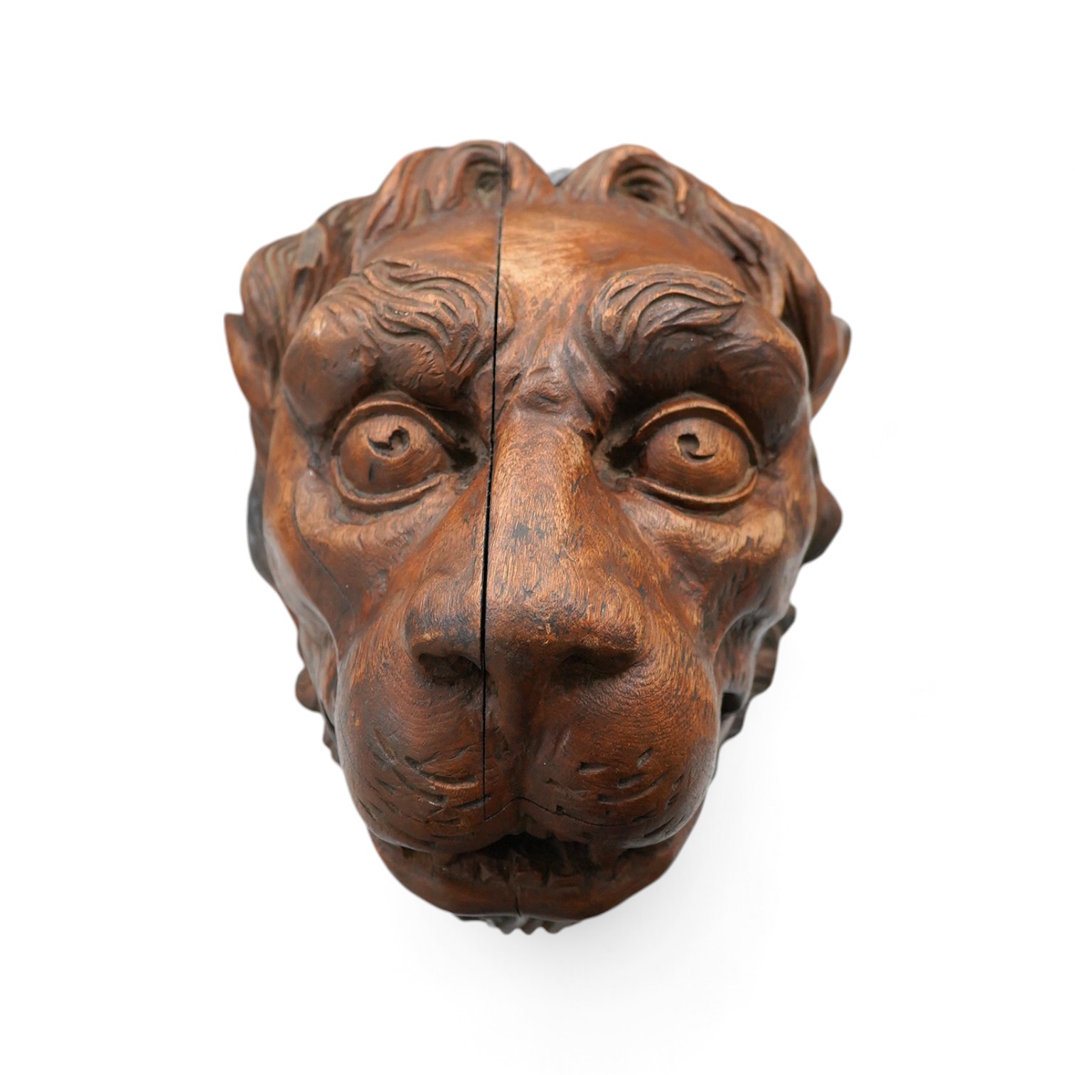 An 19th century carved 'Lion's head' corbel, 21cm high. Condition - poor